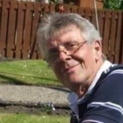 By kind permission of Maggie Lamont, a photo of Bill Lamont smilling at the camera