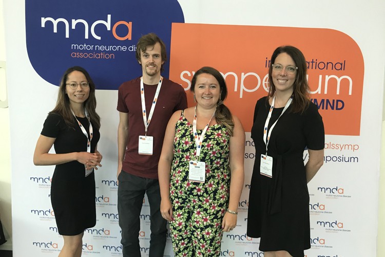 Four researchers at the MND Association International Symposium