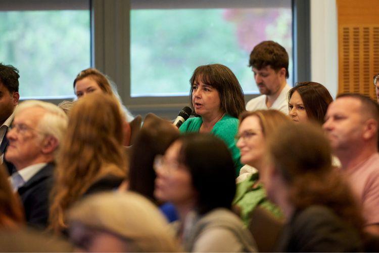 A group of researchers at a scientific symposium