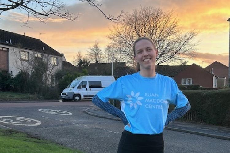 Anna Stuckert in a Euan MacDonald Centre branded running shirt setting out on her morning training run for the Edinburgh Half Marathon to raise funds for the Euan MacDonald Centre