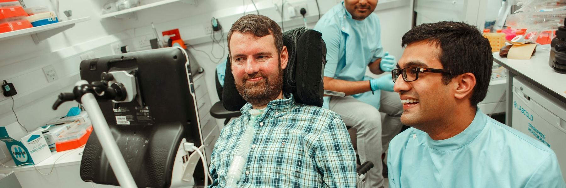 Euan and a researcher in a lab