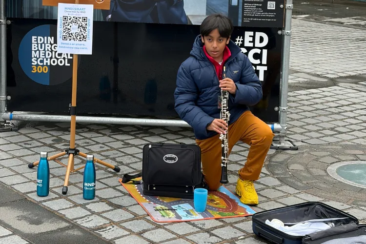 Aditya Pal busking at the Mound, Edinburgh during the Edinburgh Medical School 300 Faces Exhibition