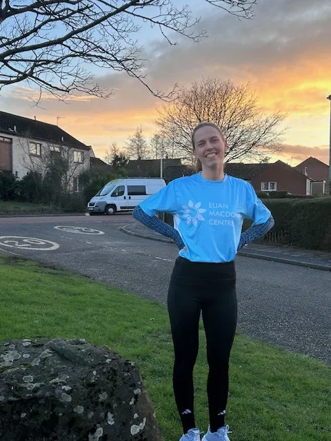 Anna Stuckert in a Euan MacDonald Centre branded running shirt setting out on her morning training run for the Edinburgh Half Marathon to raise funds for the Euan MacDonald Centre